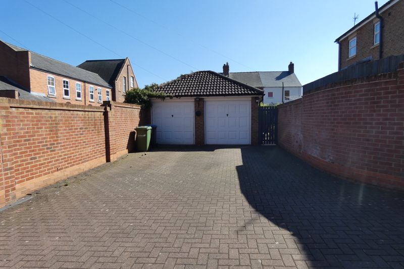 Rear Garage/Driveway- click for photo gallery